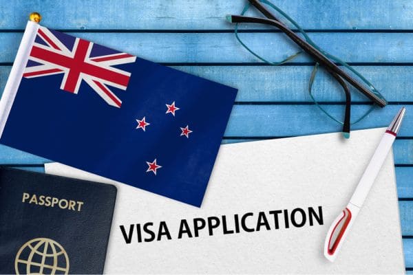 New Zealand visa application form with flag and passport