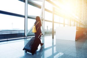 A person in the airport going to New Zealand