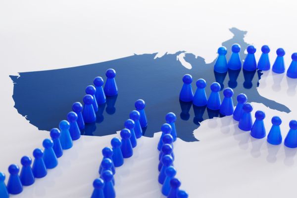 A group of blue figures stands before a map, highlighting regional talent gaps.